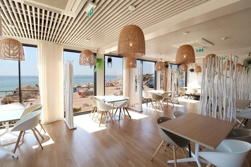 Sea-facing dining room at Pedras Amarelas on Galé beach