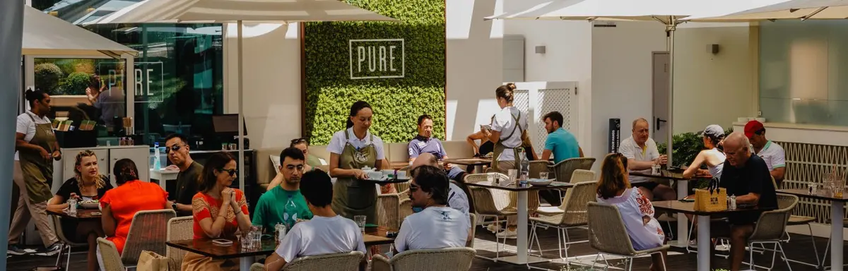 Customers seated on the patio at PURE in Quinta do Lago