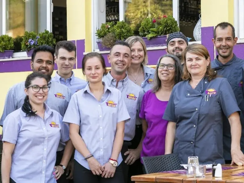 Taste restaurant team pictured in its official photo gallery