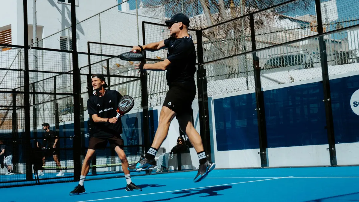 Players in action on a blue padel court at Alvor Padel Club