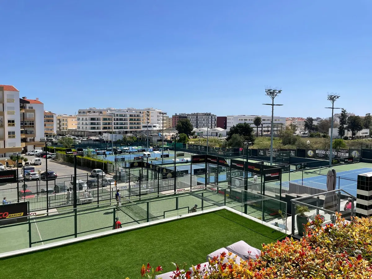 View from the clubhouse across the tennis and padel courts at Clube de Ténis e Padel de Lagos