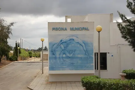 Dolphin mural and entrance of the municipal swimming pool in Martim Longo