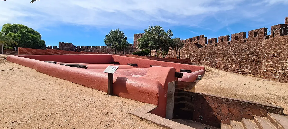 Red stone walls and the courtyard inside Silves castle