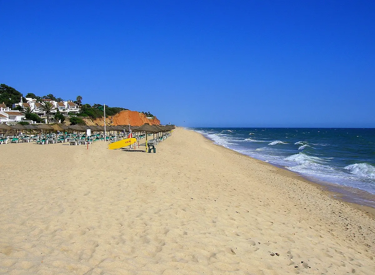 Golden cliffs and the sandy beach at Vale do Lobo